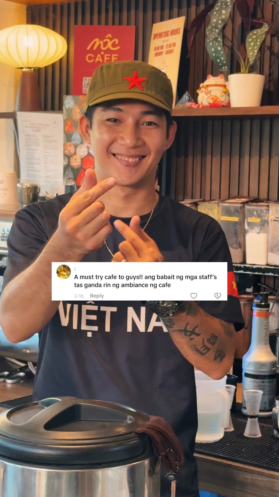 Vietnamese chef at MỘC Cafe bar smiling warmly
